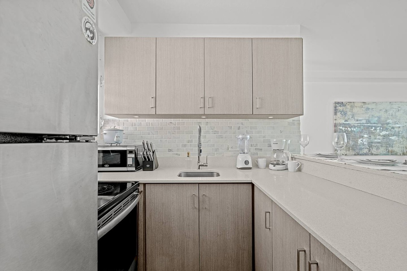 Kitchen with a refrigerator, microwave, and sink — Ocean Park 2BR · Steps to Beach & Dining, Santurce