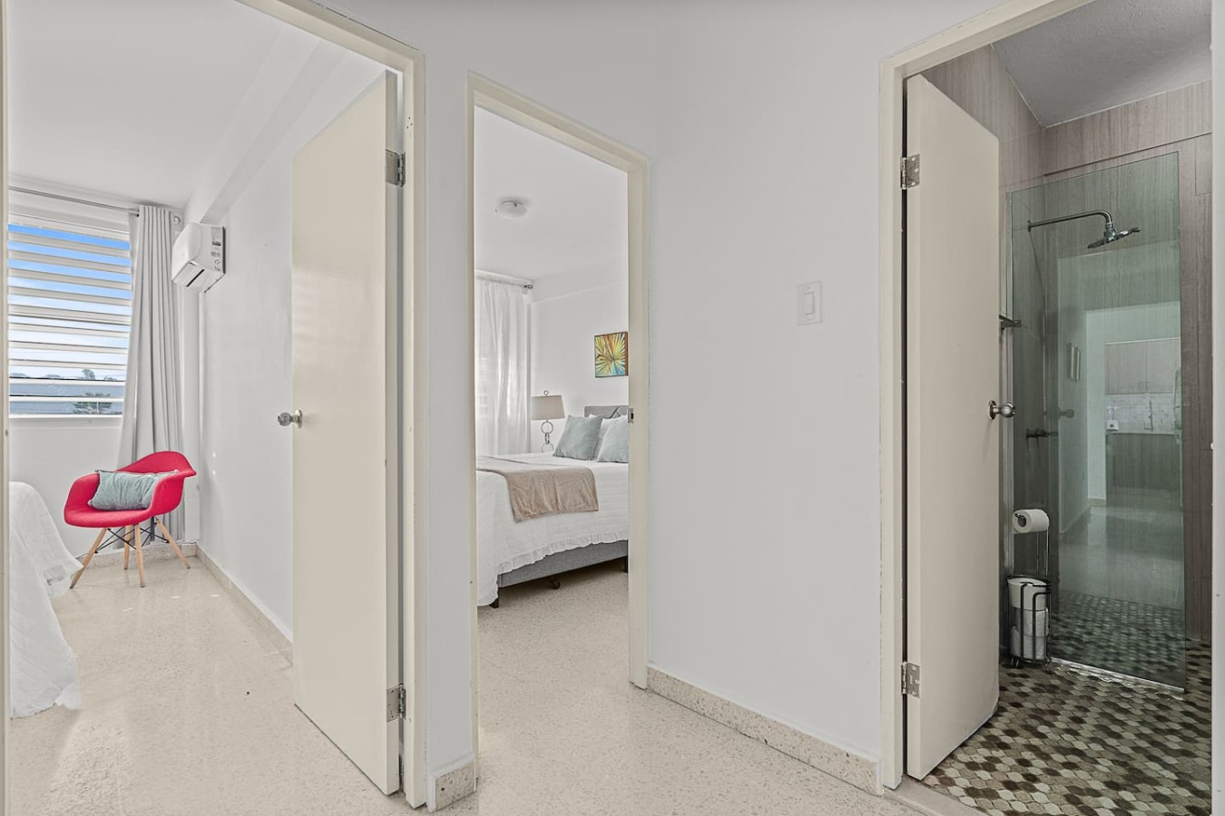 Hallway with doors to a bedroom and the bathroom — Ocean Park 2BR · Steps to Beach & Dining, Santurce