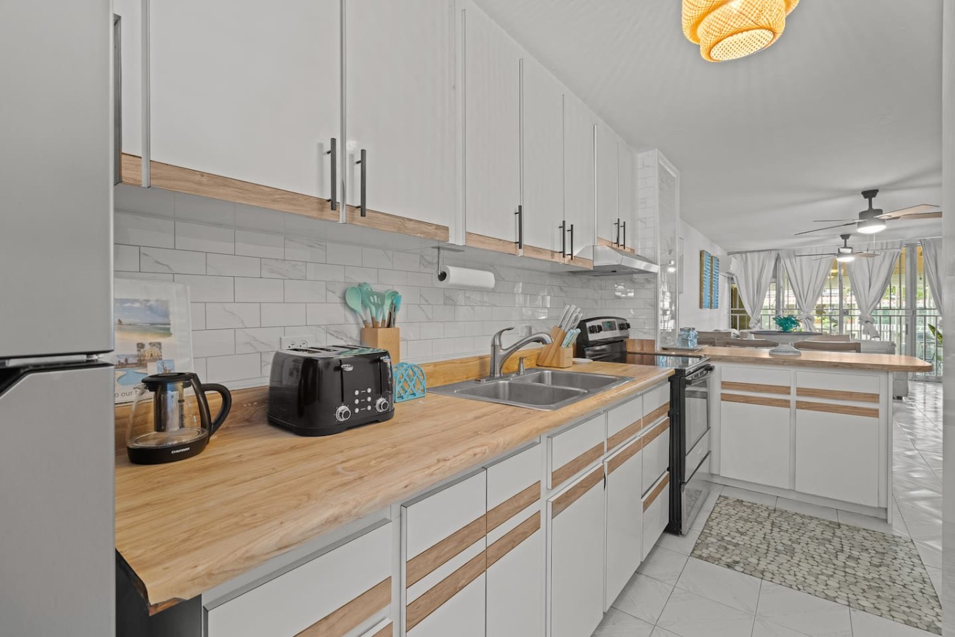Kitchen with a wood counter, a sink and a toaster — Beachside Villa Dorado Pool Beach Access