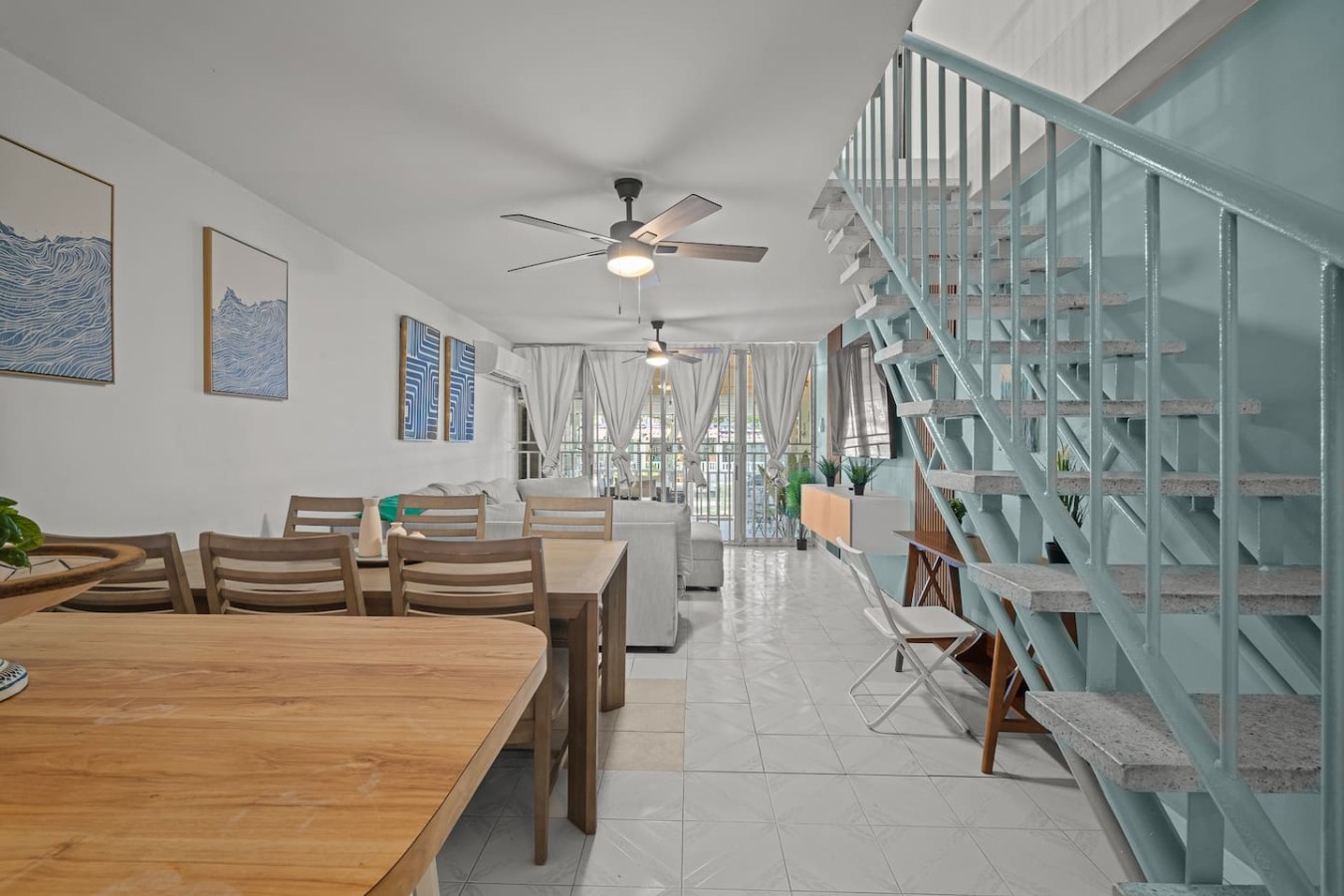 Dining room table with chairs and a ceiling fan — Beachside Villa Dorado Pool Beach Access