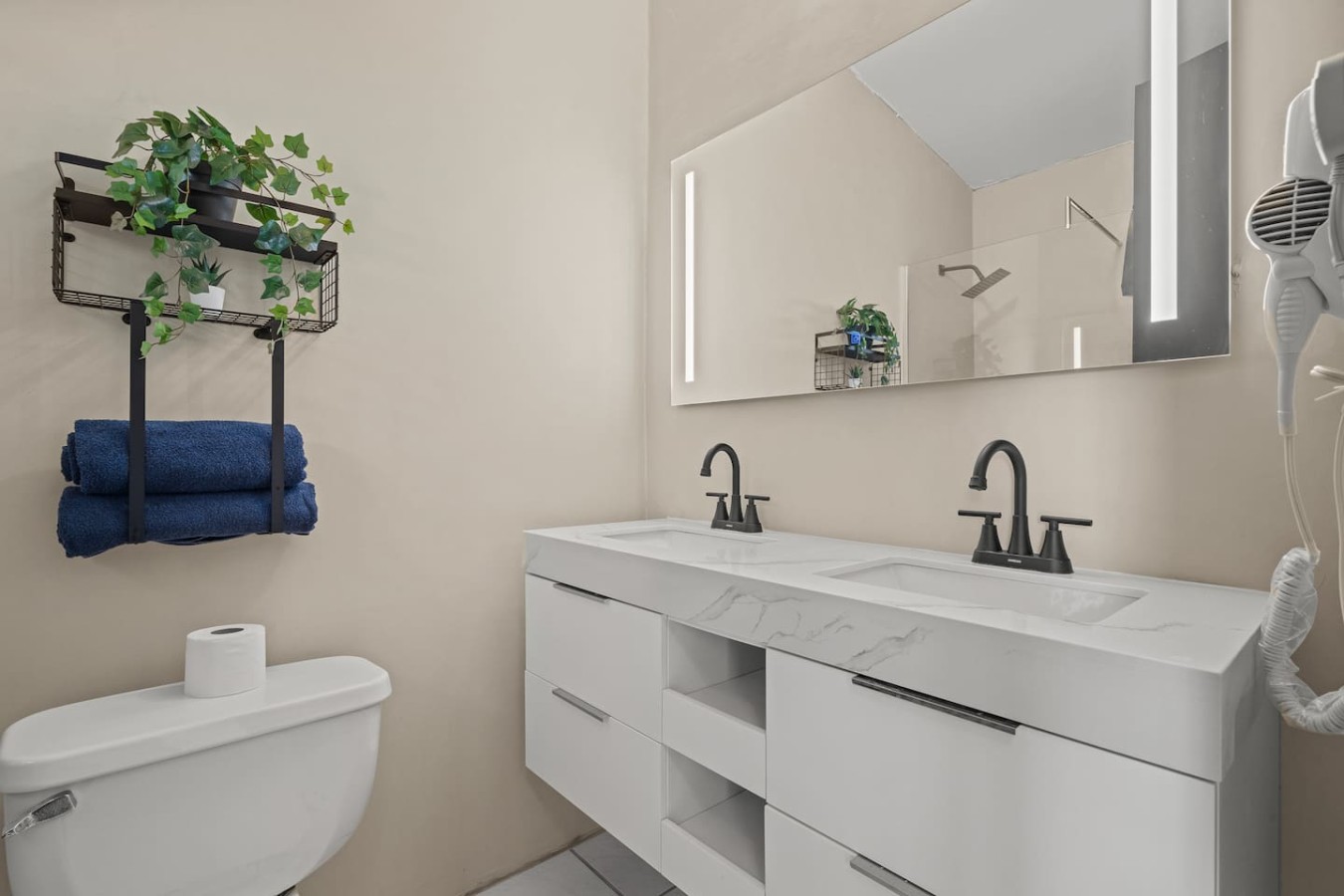 Bathroom with a double vanity and a toilet — Beachside Villa Dorado Pool Beach Access