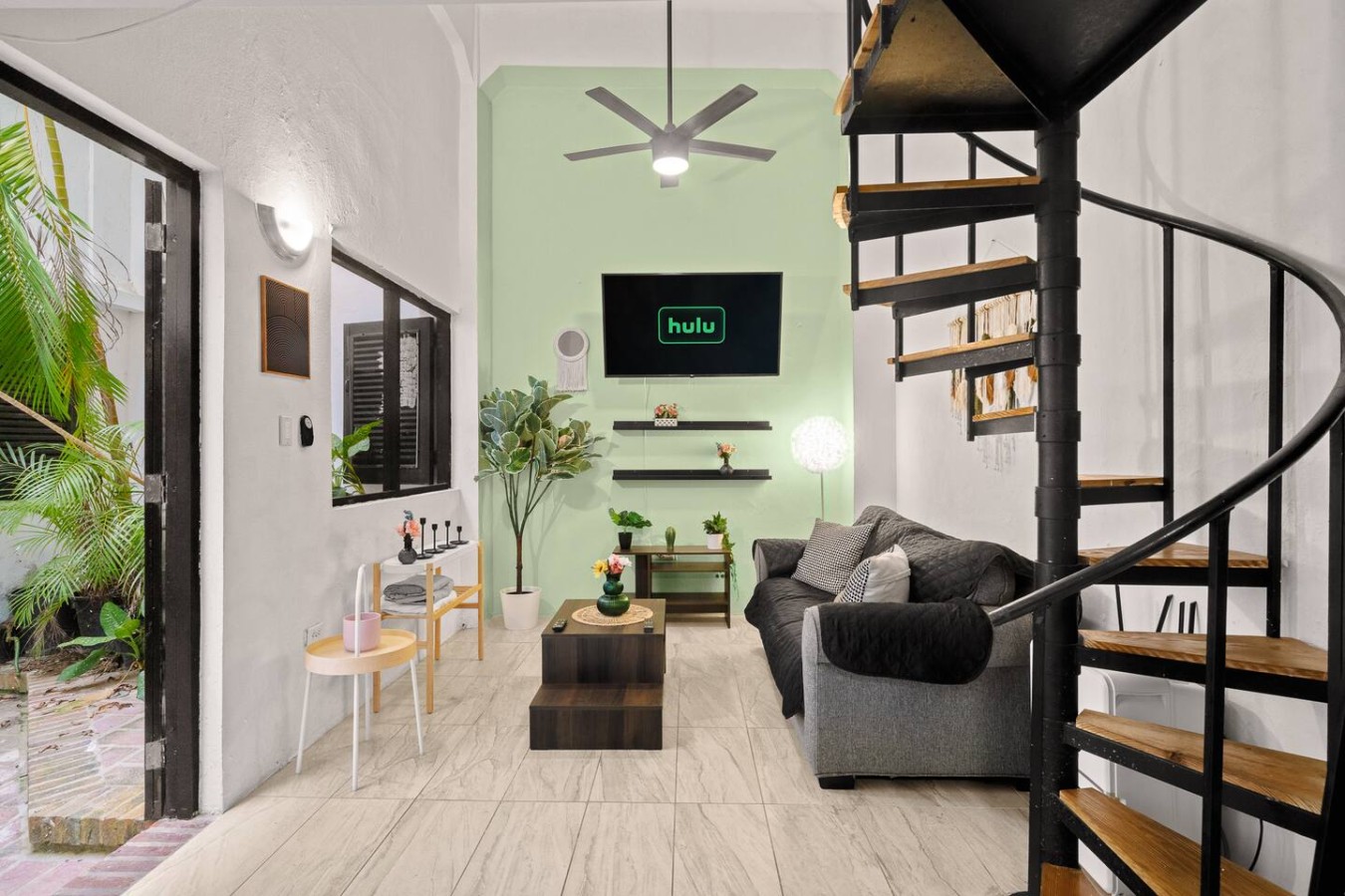 Living room with a couch and a television — Historic Loft in the Heart of Old San Juan, Old San Juan