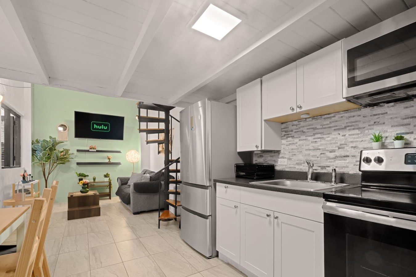 Kitchen with a refrigerator, sink, and stove — Historic Loft in the Heart of Old San Juan, Old San Juan
