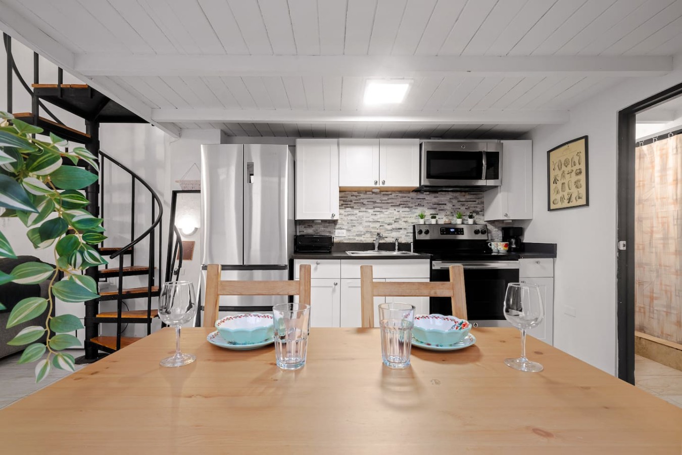 Dining table with chairs and plates — Historic Loft in the Heart of Old San Juan, Old San Juan