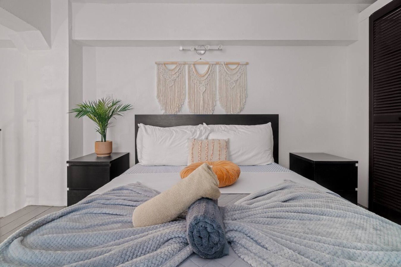 Bedroom with a bed, a potted plant, and a hanging tapestry — Historic Loft in the Heart of Old San Juan, Old San Juan