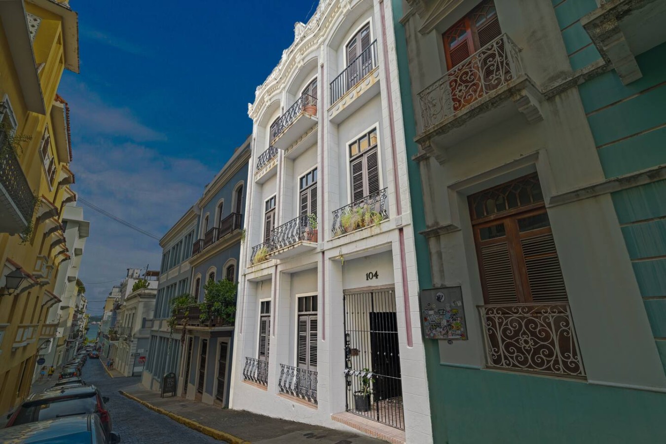White building with balconies and a view of the ocean — Historic Loft in the Heart of Old San Juan, Old San Juan