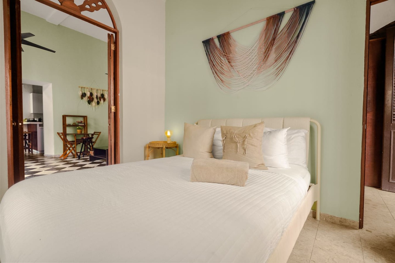 Bedroom with a white bed and a green wall — 3B Imperial, Old San Juan