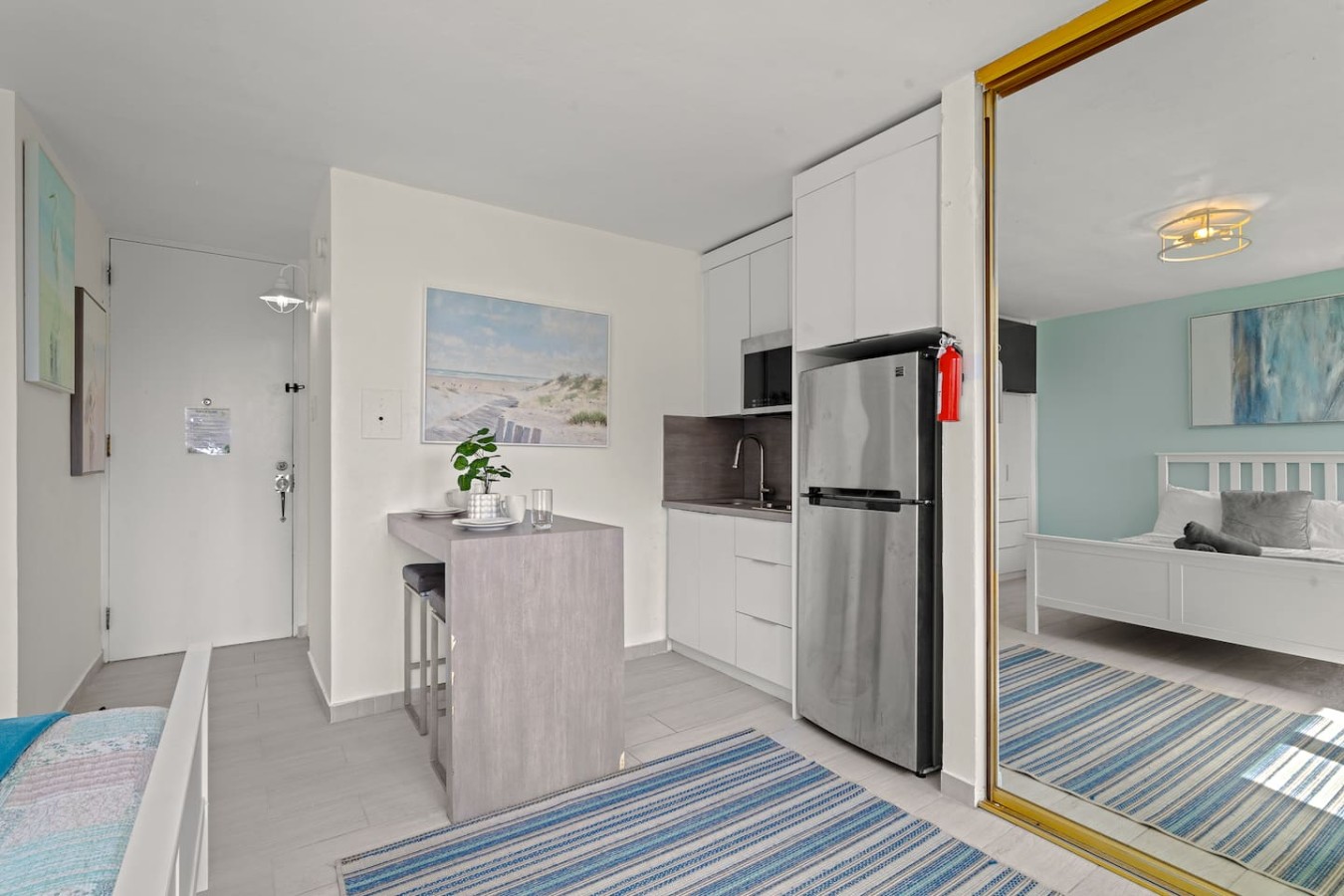 Kitchen with a refrigerator, sink, and countertops — Casa Celeste | Sunlit Tropical Stay in Condado, Santurce