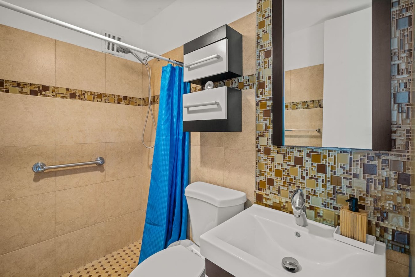 Bathroom with a blue shower curtain and a white toilet — Casa Celeste | Sunlit Tropical Stay in Condado, Santurce