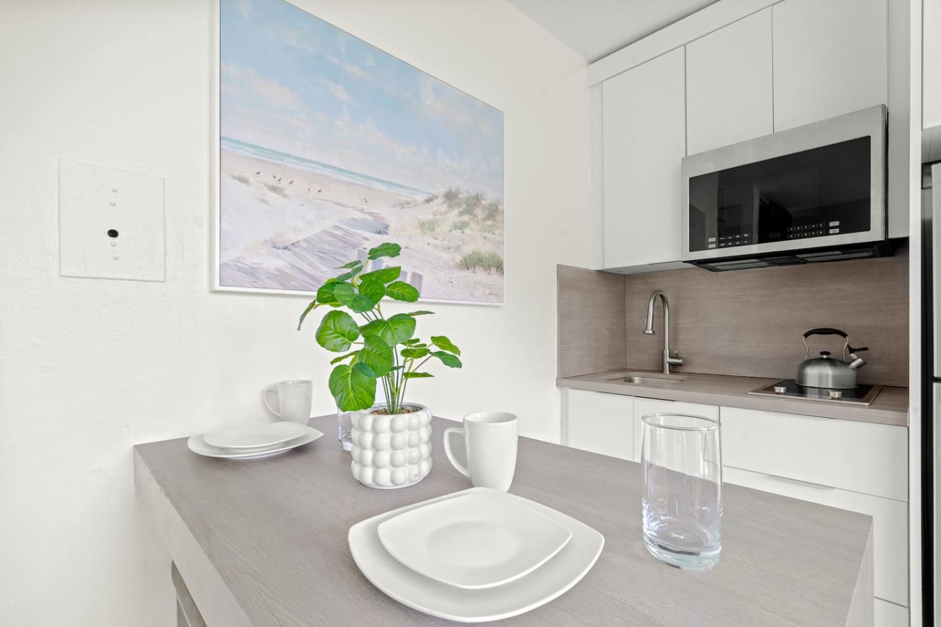 Dining table with a potted plant on it — Casa Celeste | Sunlit Tropical Stay in Condado, Santurce