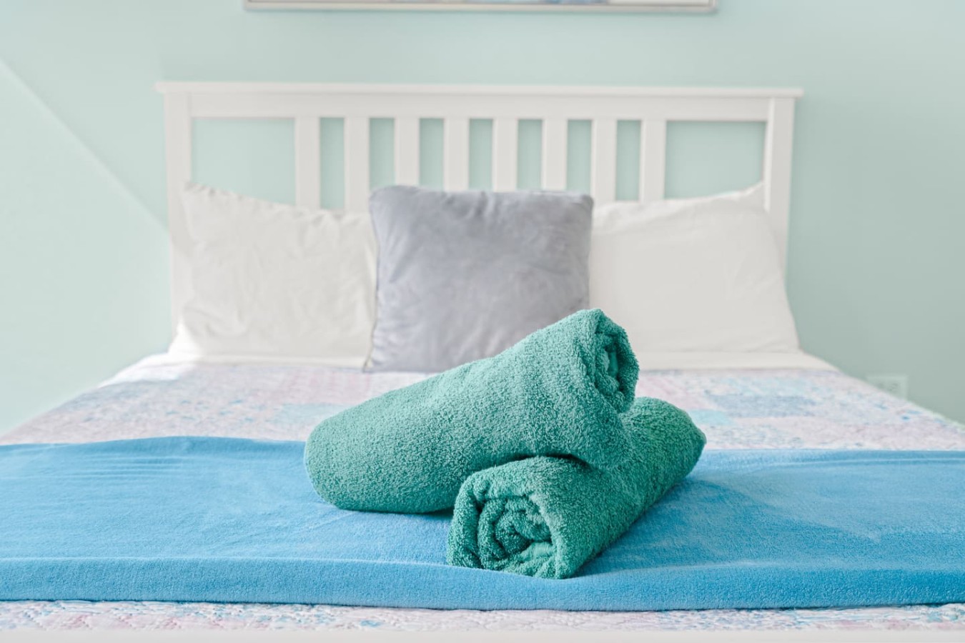 Two green towels on a bed — Casa Celeste | Sunlit Tropical Stay in Condado, Santurce