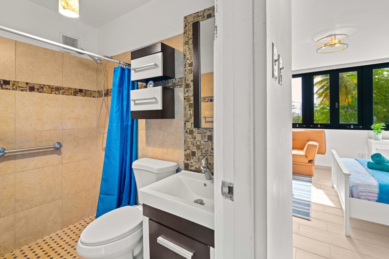 Bathroom with a toilet, sink, and shower — Casa Celeste | Sunlit Tropical Stay in Condado, Santurce