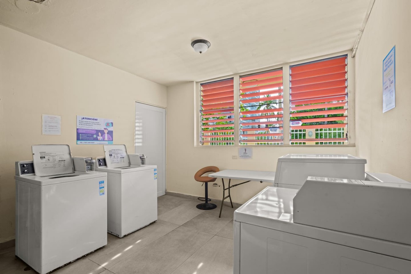 Shared laundry room with washers and dryers — Casa Celeste | Sunlit Tropical Stay in Condado, Santurce