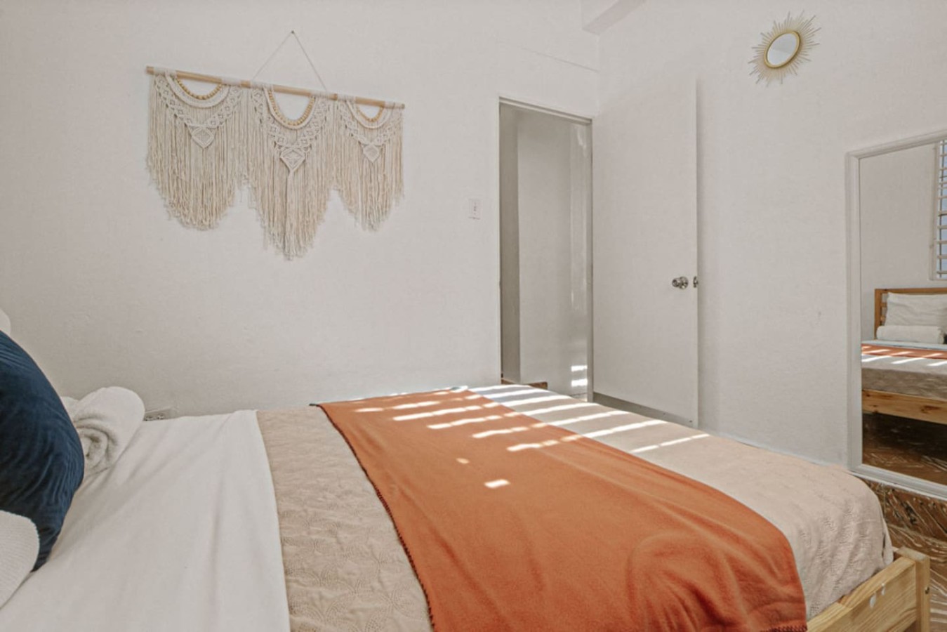 Bedroom with a bed and a curtain on the window — Virelia | Colorful San Juan Escape for Four, Santurce