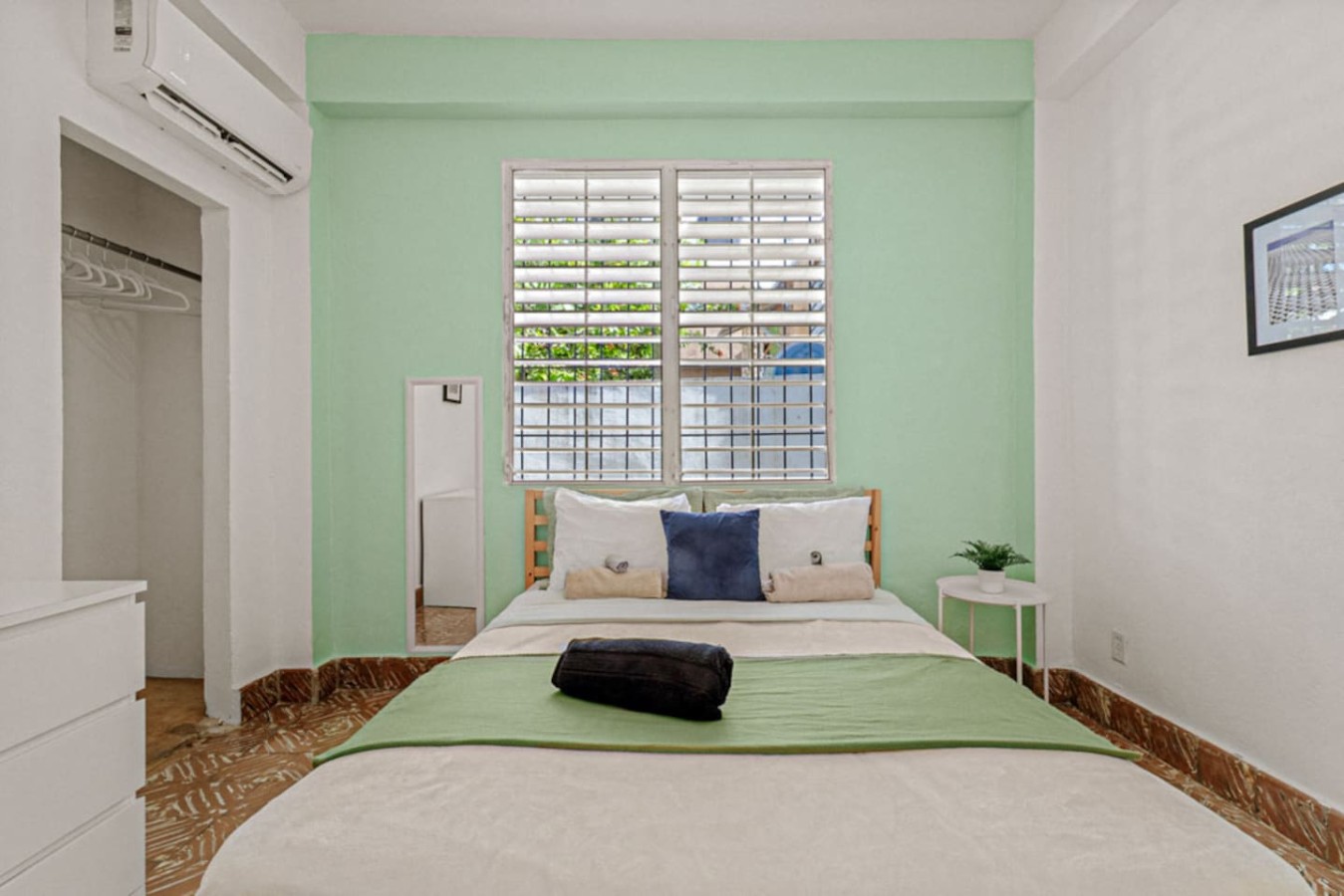 Bedroom with a bed and a window view — Virelia | Colorful San Juan Escape for Four, Santurce