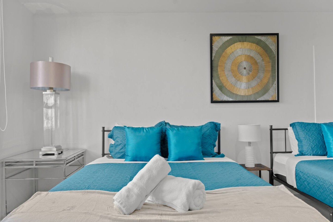 Bedroom with a blue bedspread and blue pillows — T-Mobile District San Juan Next to Beach, San Juan