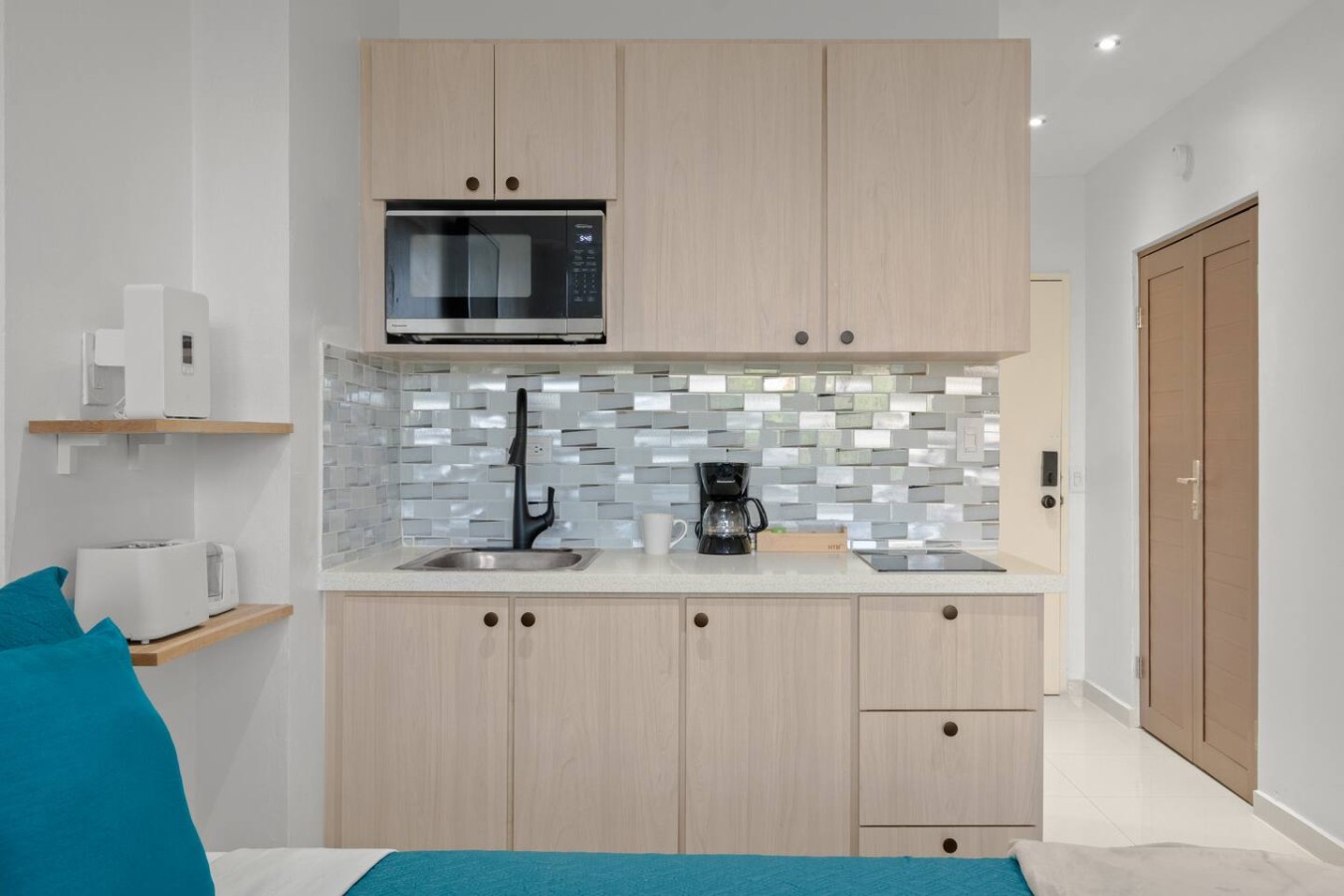 Kitchen with a microwave and a coffee maker — T-Mobile District San Juan Next to Beach, San Juan