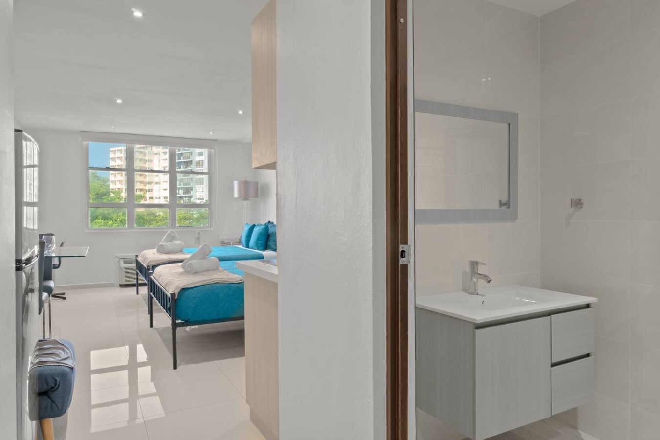 Bathroom with a vanity, next to the bedroom — T-Mobile District San Juan Next to Beach