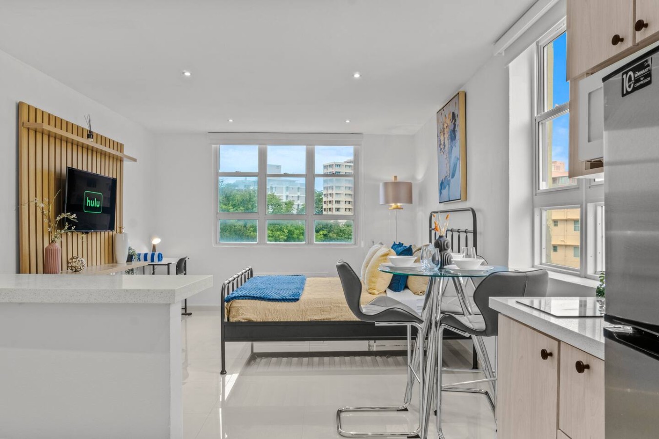 Bedroom with a bed and a window overlooking the city (bedroom 2) — Caribbean Sea View | Tmobile District Free Parking, San Ju
