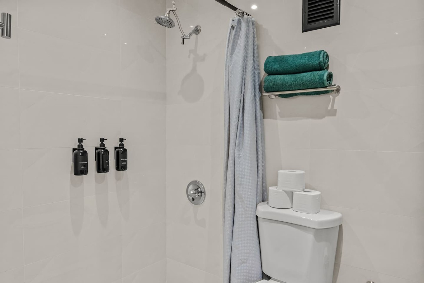 Bathroom with a shower and a toilet — Caribbean Sea View | T-Mobile District Free Parking, San Juan