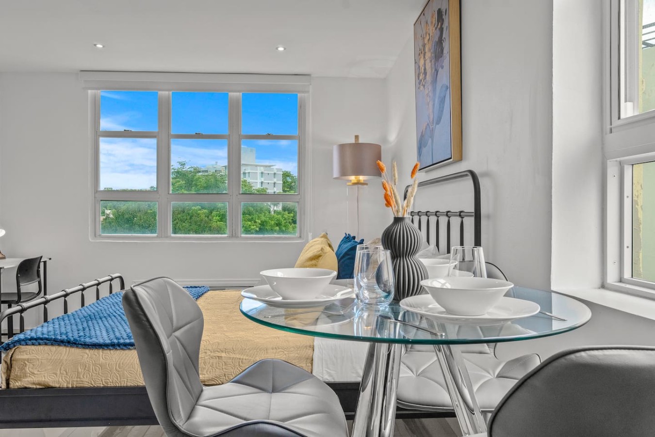 Bedroom with a bed, a chair, and a window with a view of the — Caribbean Sea View | Tmobile District Free Parking, San Juan