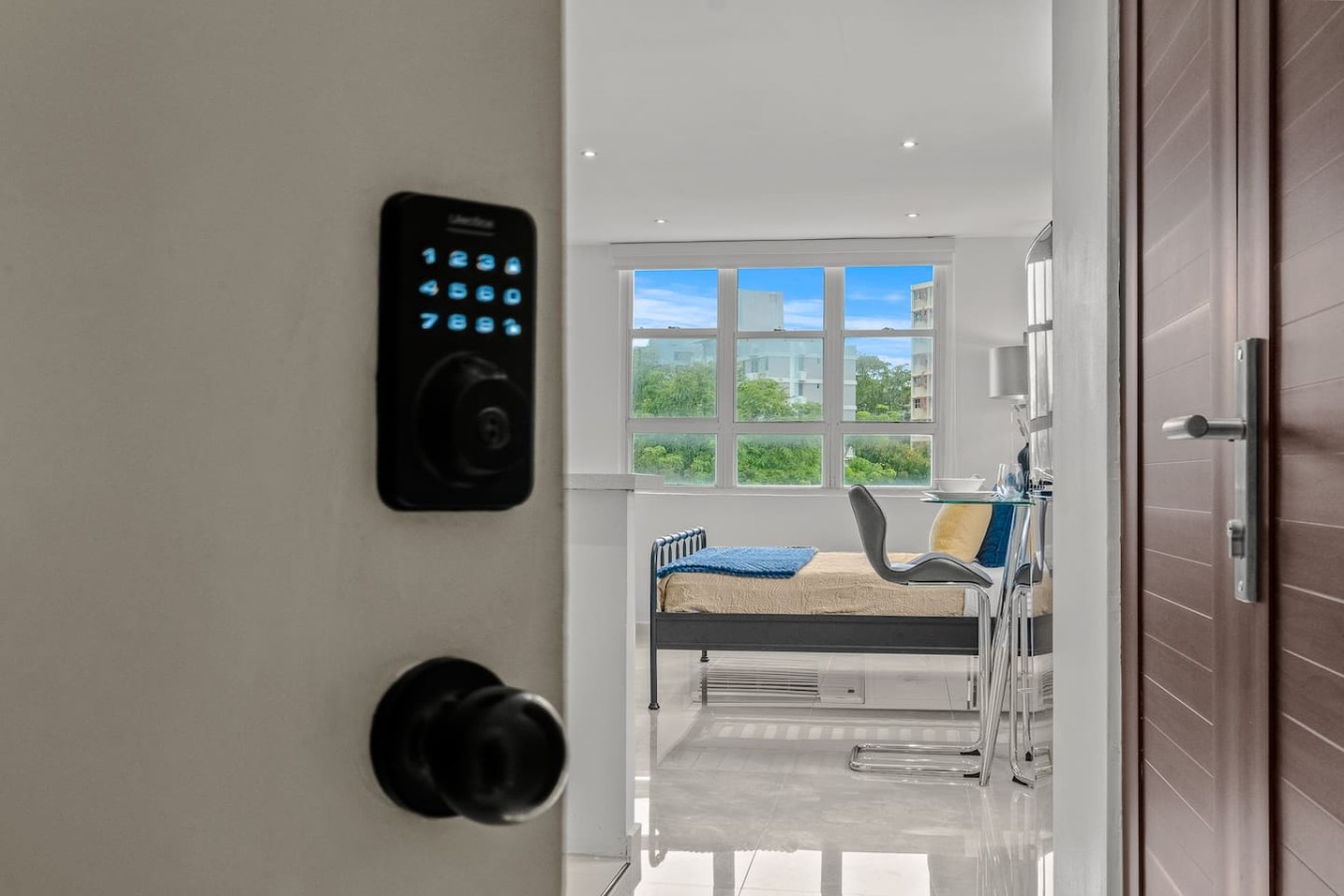 Entrance door with a keypad lock — Caribbean Sea View | T-Mobile District Free Parking, San Juan