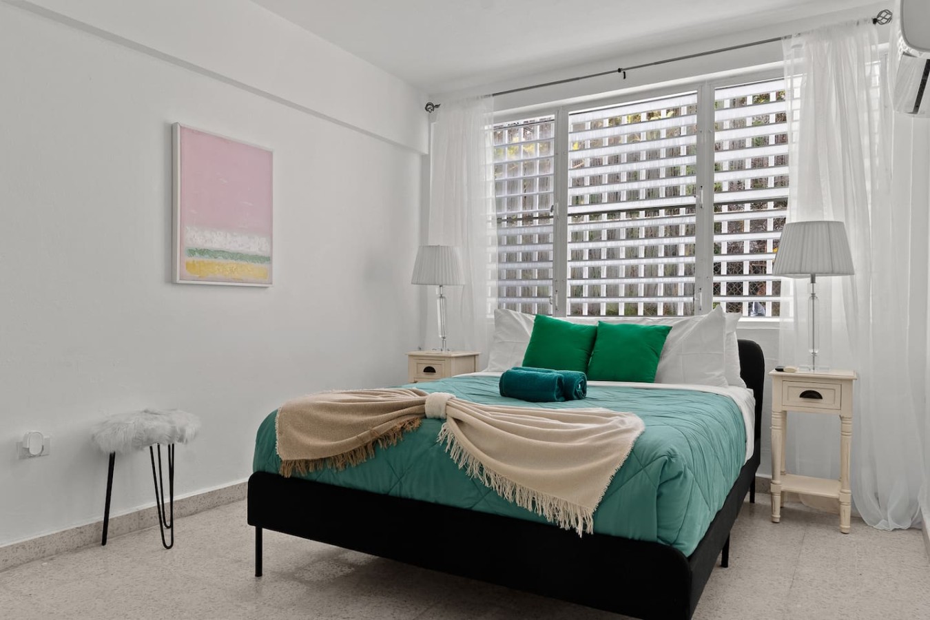 Bedroom with a large bed and a view of the ocean — Private Patio 2BR Near Ocean Park Beach, Santurce
