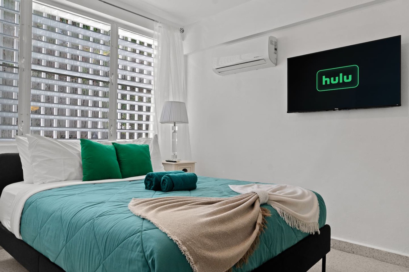 Bedroom with a bed and a television — Private Patio 2BR Near Ocean Park Beach, Santurce