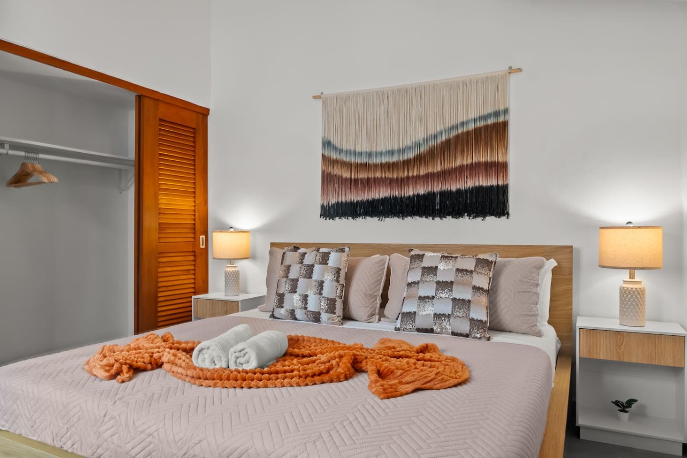 Bedroom with a bed, a lamp, and a rug on the floor — Grand Galleria — Old San Juan Private Patio, Old San Juan
