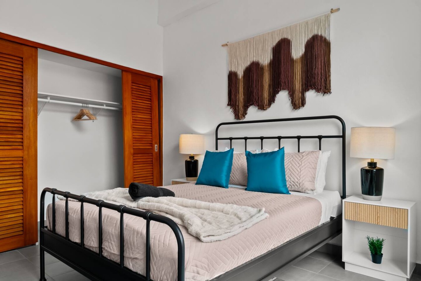 Bedroom with a bed and a lamp — Grand Galleria — Old San Juan Private Patio, Old San Juan