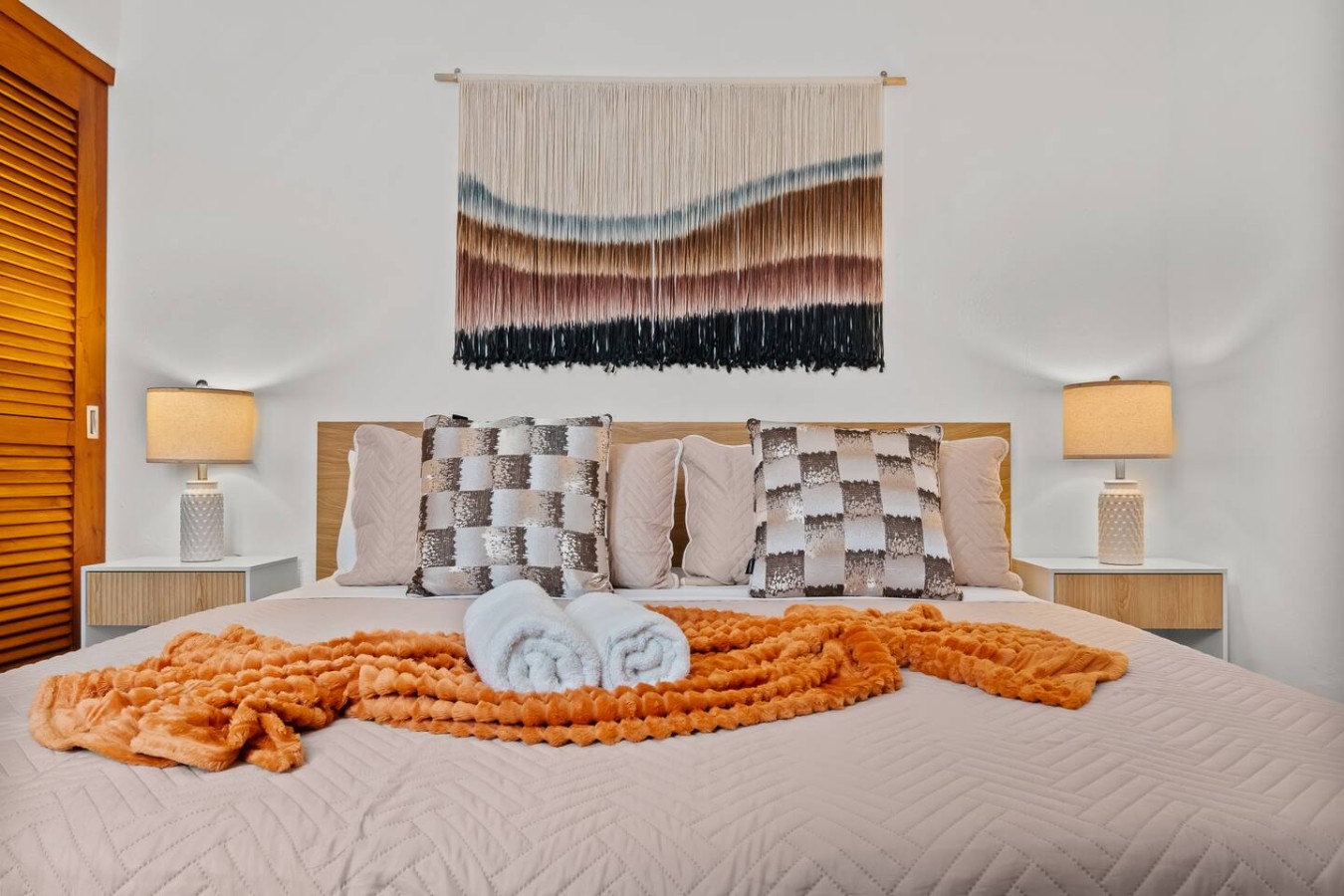 Bedroom with a large bed and a colorful blanket on it — Grand Galleria — Old San Juan Private Patio, Old San Juan