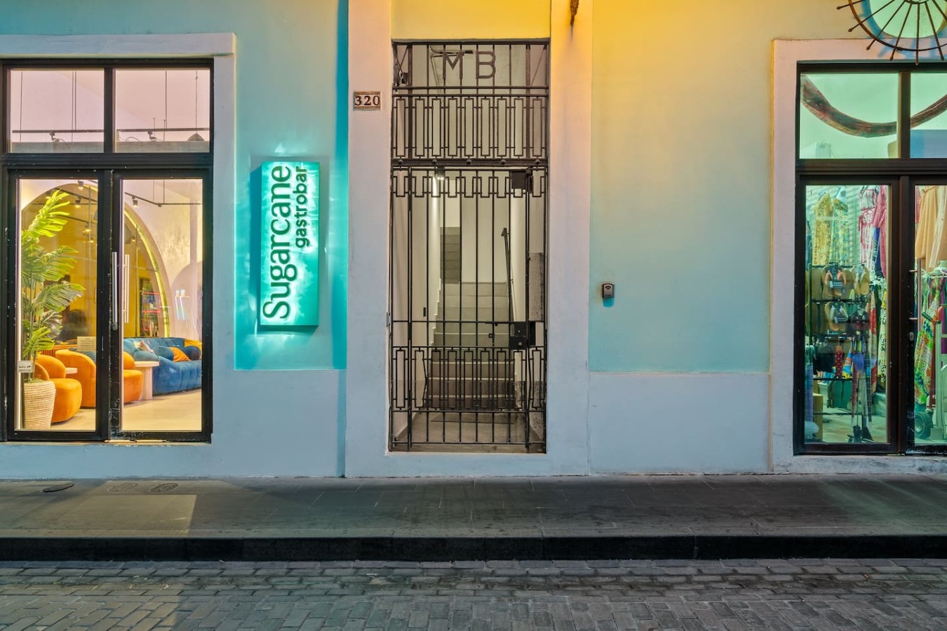 Blue sign with white letters on a white building — Casa Valencia | Old San Juan, Old San Juan
