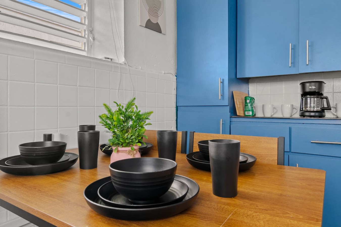 Dining table with black bowls and cups on it — Santurce Blue 2BR | Near Beach & La Placita