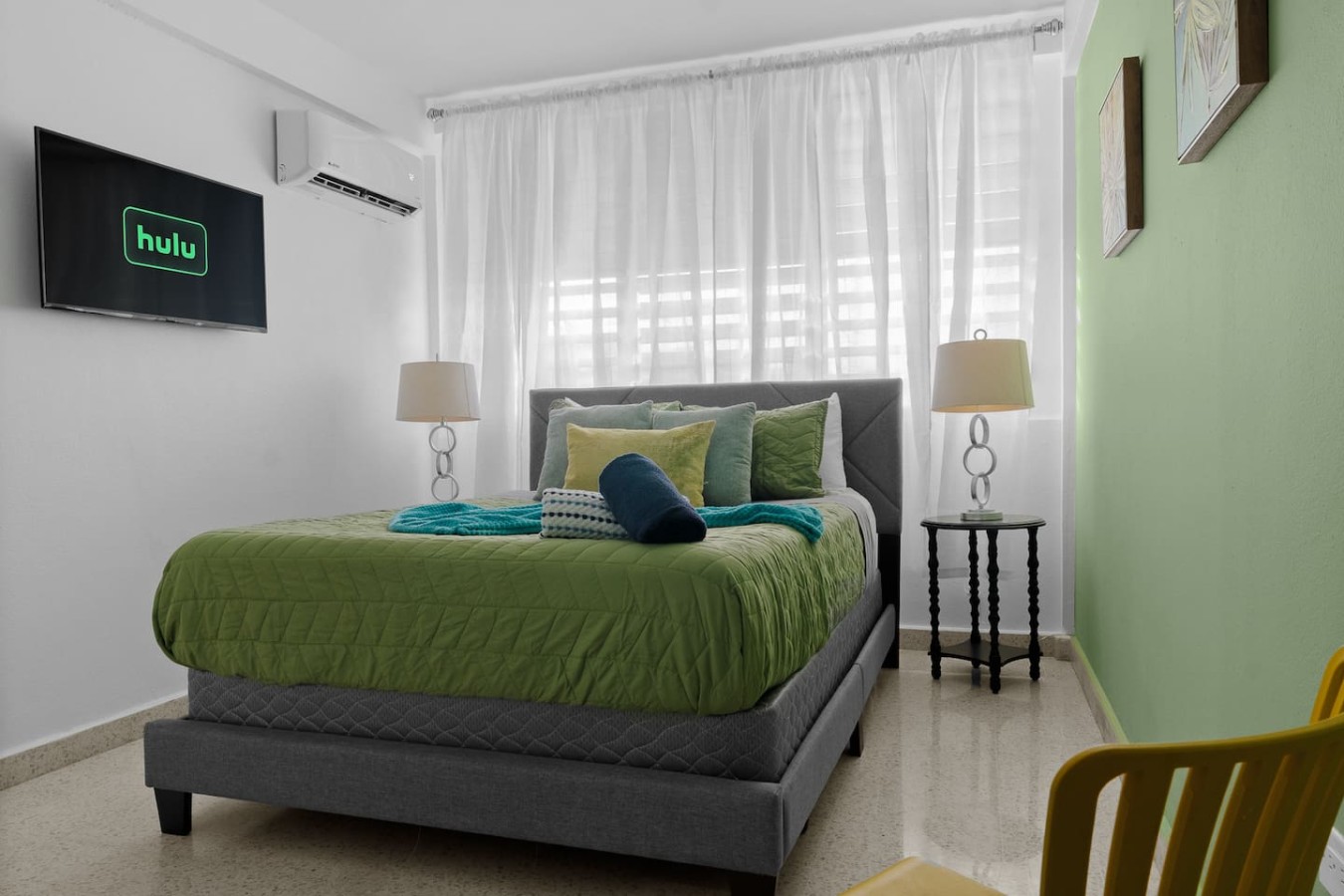 Bedroom with a large bed and two pillows — Maré 2BR | Near Ocean Park Beach + Laundry, Santurce