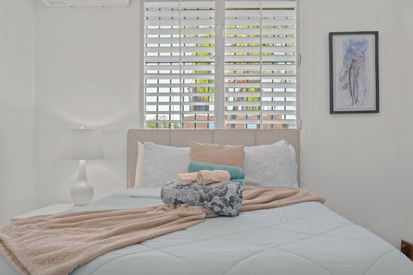 Bedroom with a large bed — Aurelia | Three Bedrooms in the Heart of San Juan, Santurce