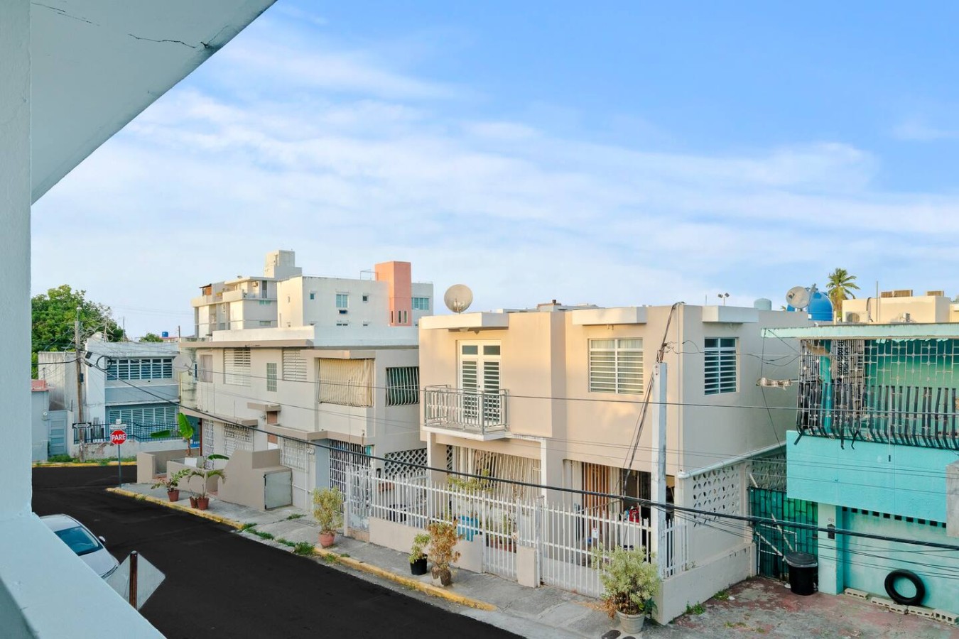 Houses across the street, seen from the porch — Aurelia | Three Bedrooms in the Heart of San Juan, Santurce