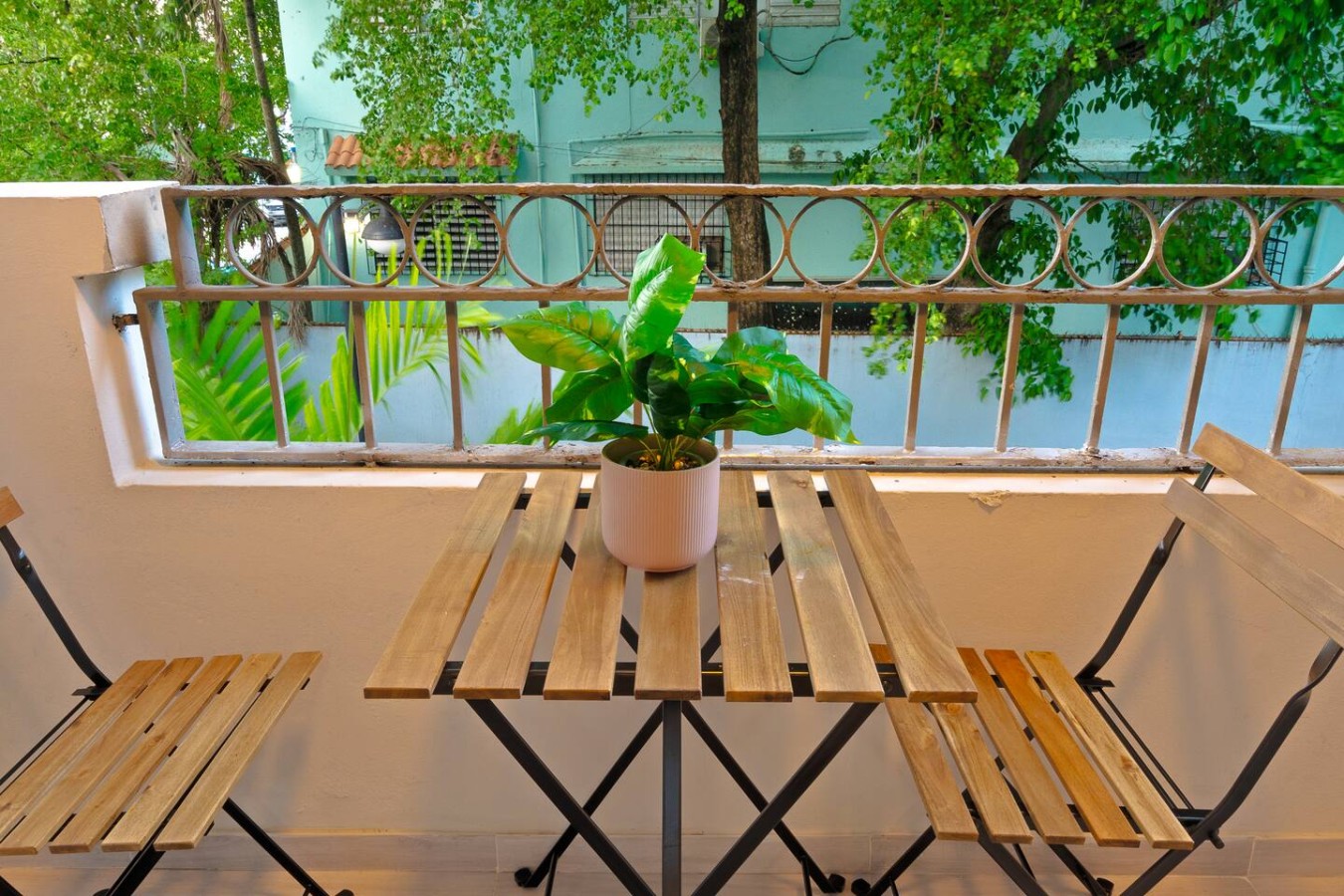 Balcony with a potted plant on it — San Juan 2BR | Sleeps 7 + Balcony & Laundry, Santurce