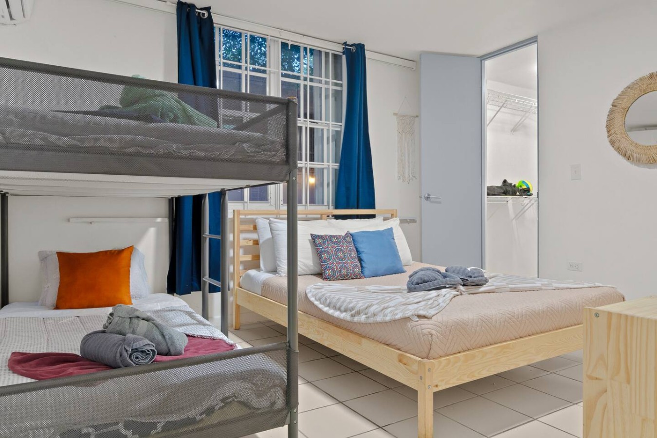 Two bunk beds in a bedroom — The Castillo | Sleeps 8 | 2BR + Backyard & Parking, Santurce