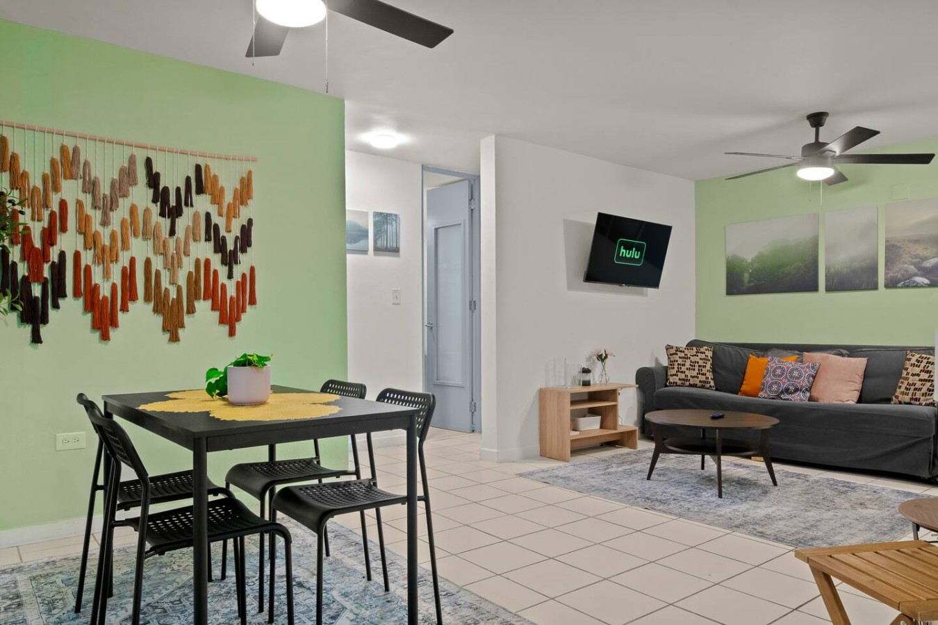 Dining table with chairs in a vacation rental property — The Castillo | Sleeps 8 | 2BR + Backyard & Parking, Santurce