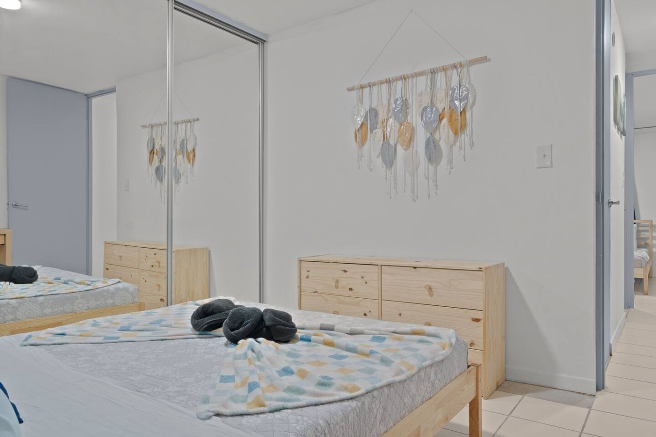 Bedroom with a bed and a mirror — The Castillo | Sleeps 8 | 2BR + Backyard & Parking, Santurce