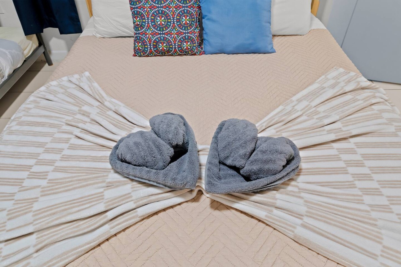 Two grey bathrobes on a bed — The Castillo | Sleeps 8 | 2BR + Backyard & Parking, Santurce