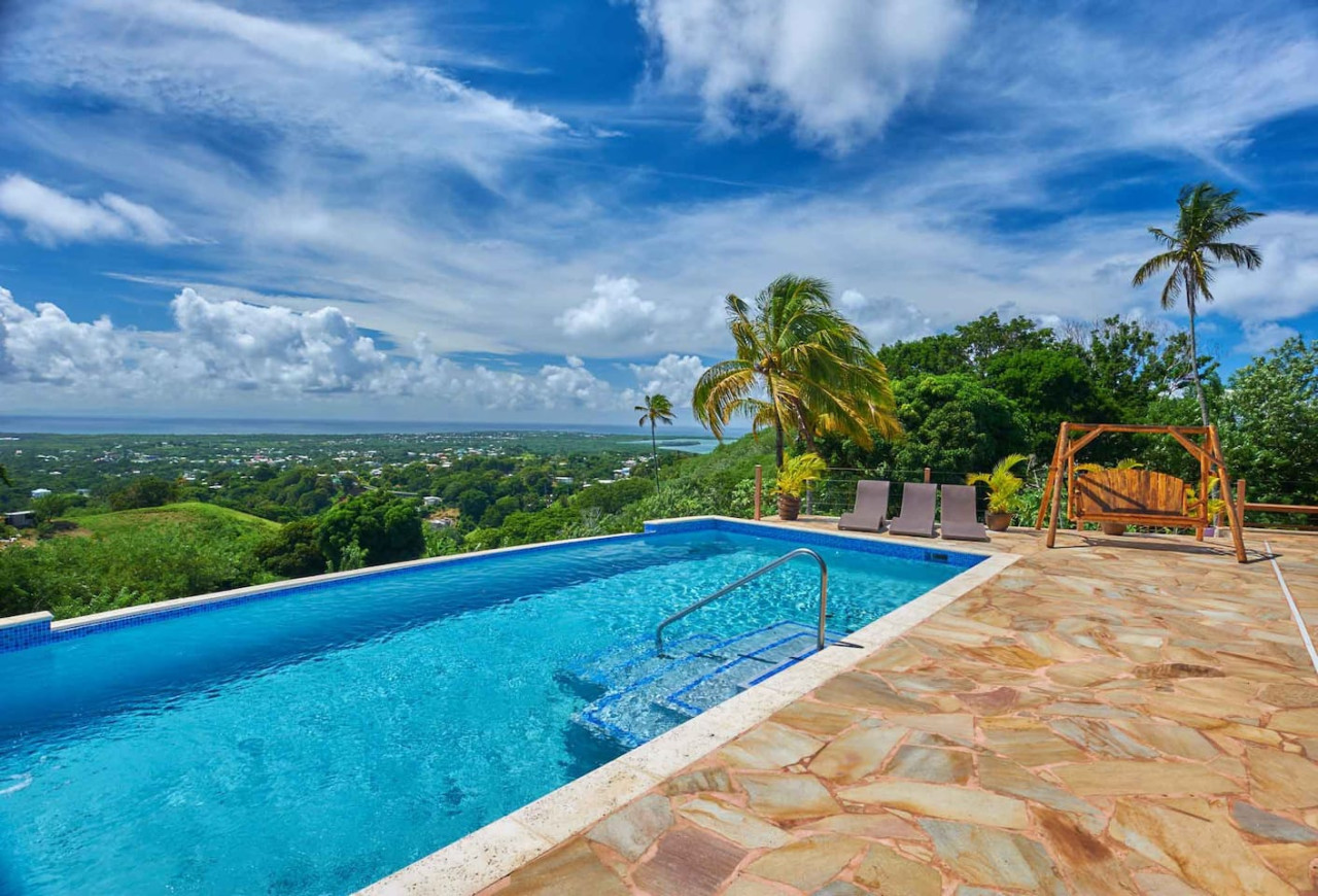 Infinity pool with floating beach chairs