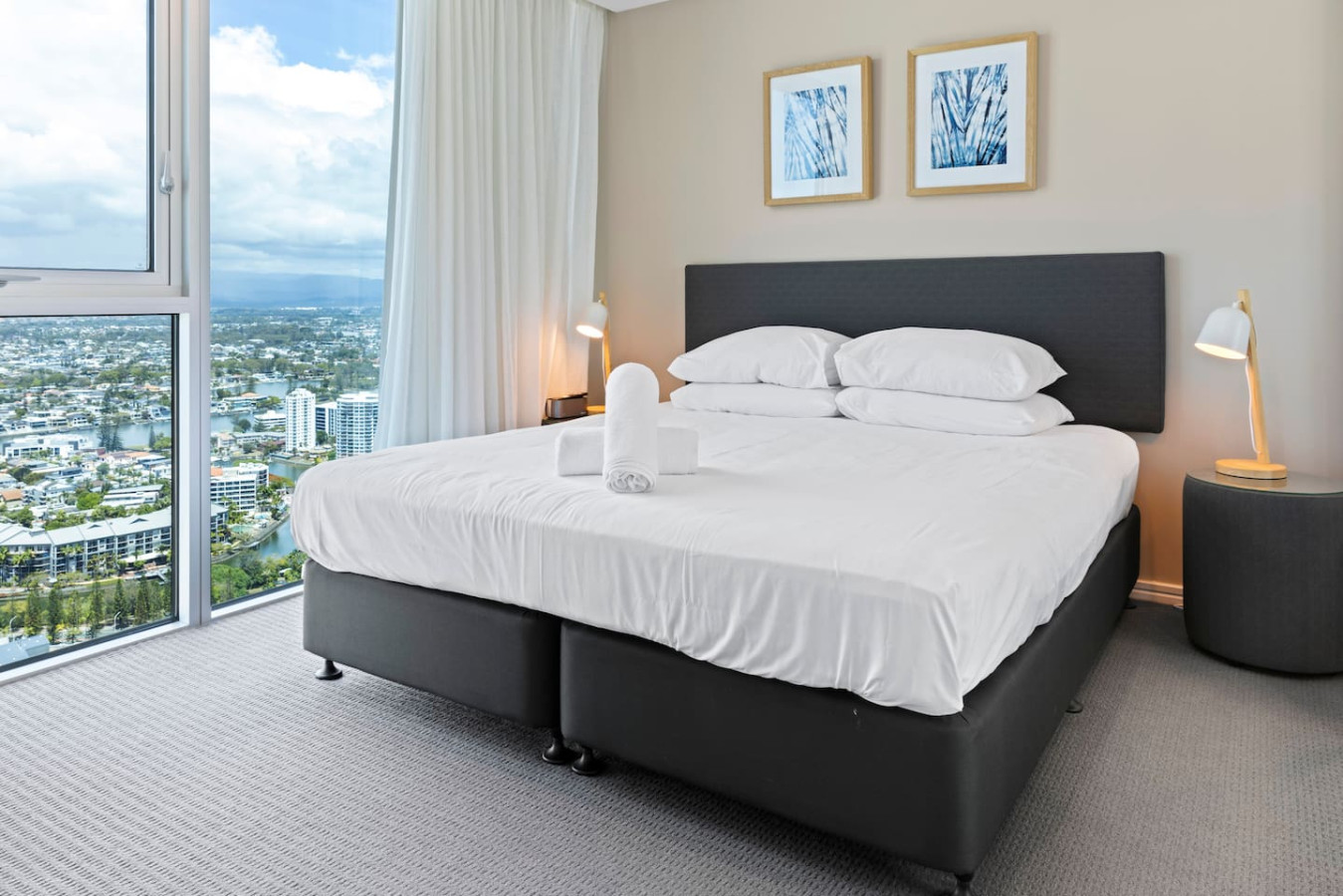 Experience ultimate comfort and stunning city views from your bedroom.