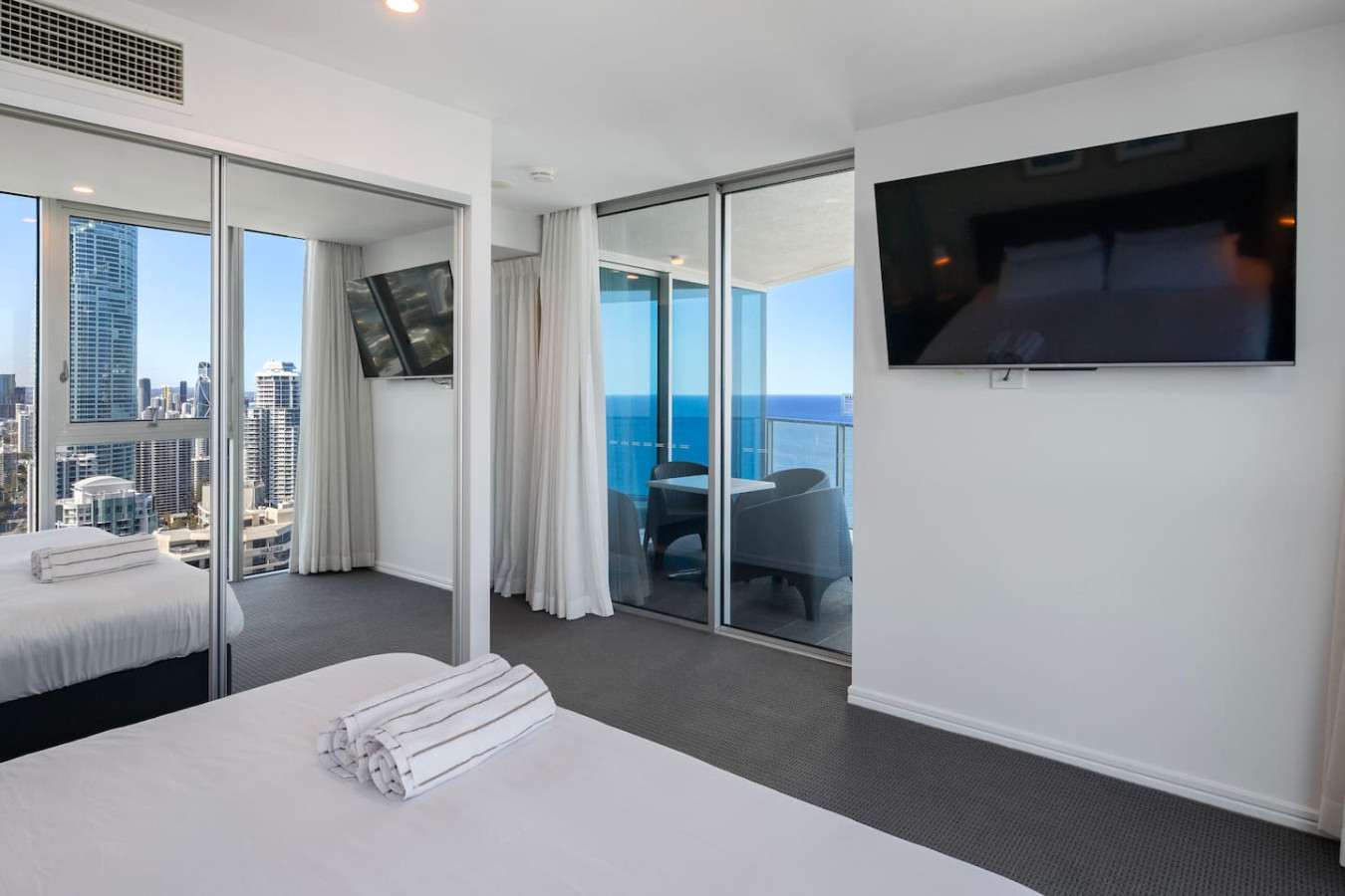 Experience ultimate comfort and stunning city views from your bedroom.