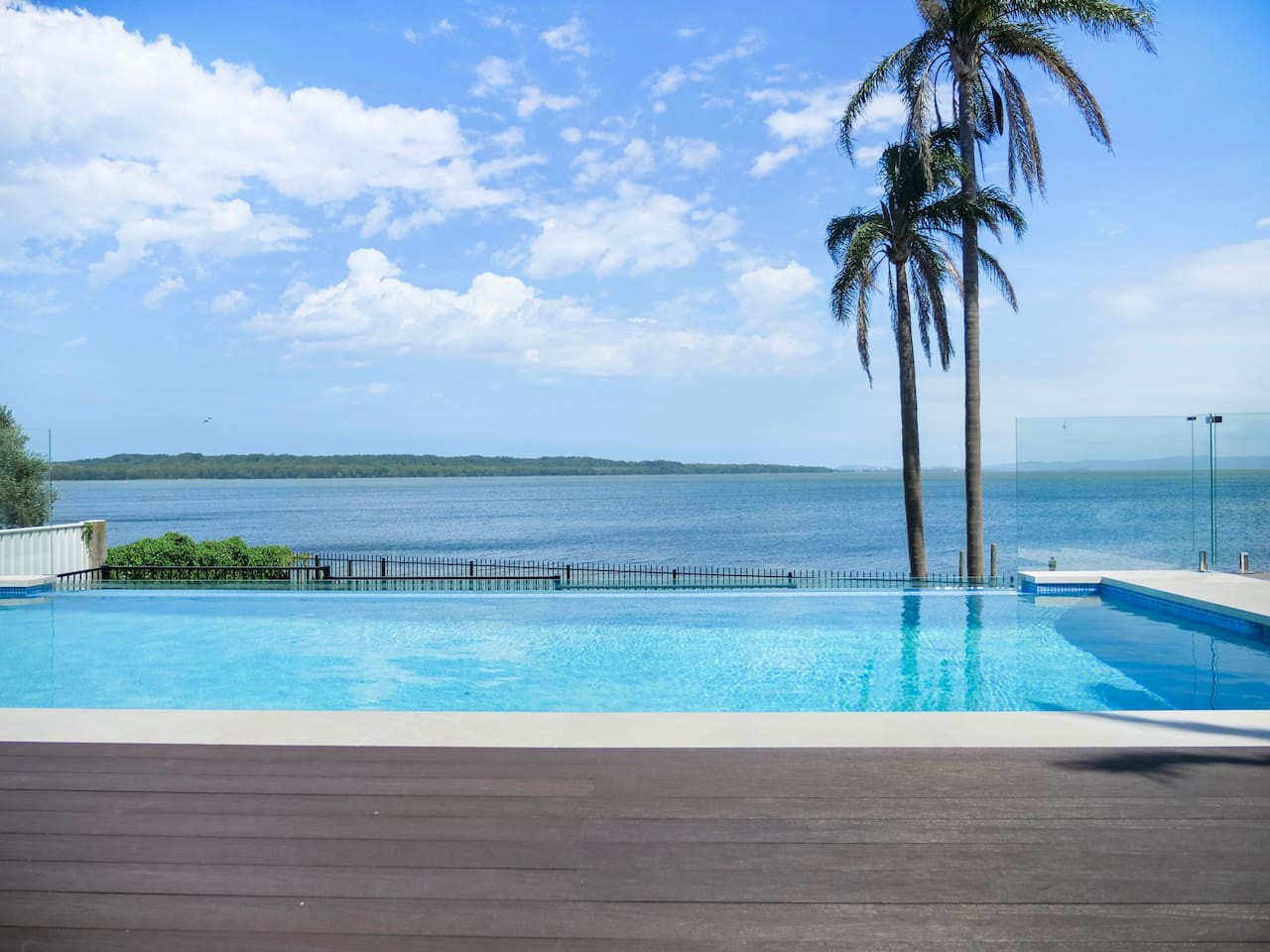 Enjoy the serenity of our pool with stunning lakefront vistas.