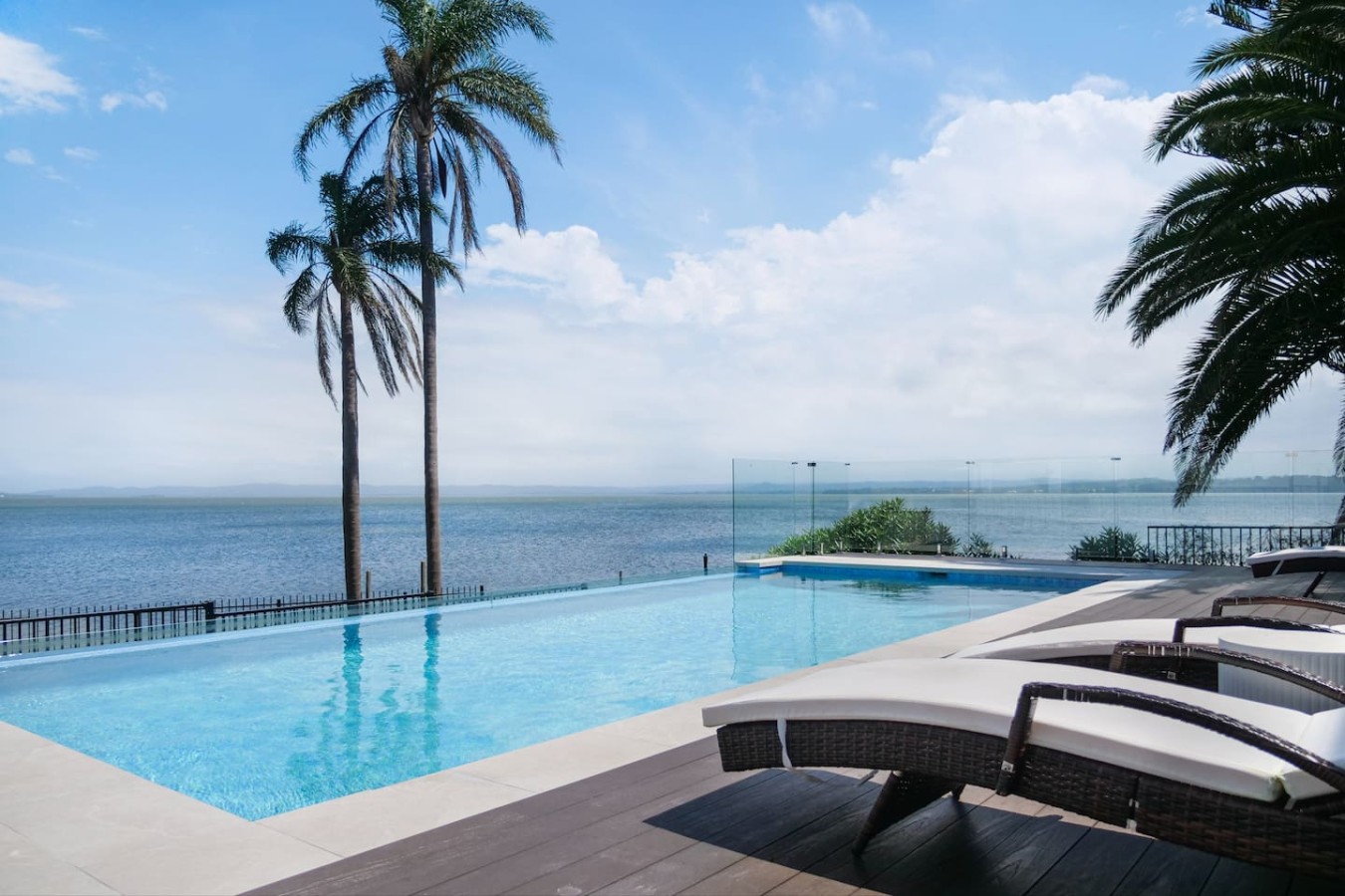 Relax and unwind by the pool with a breathtaking lakefront view.