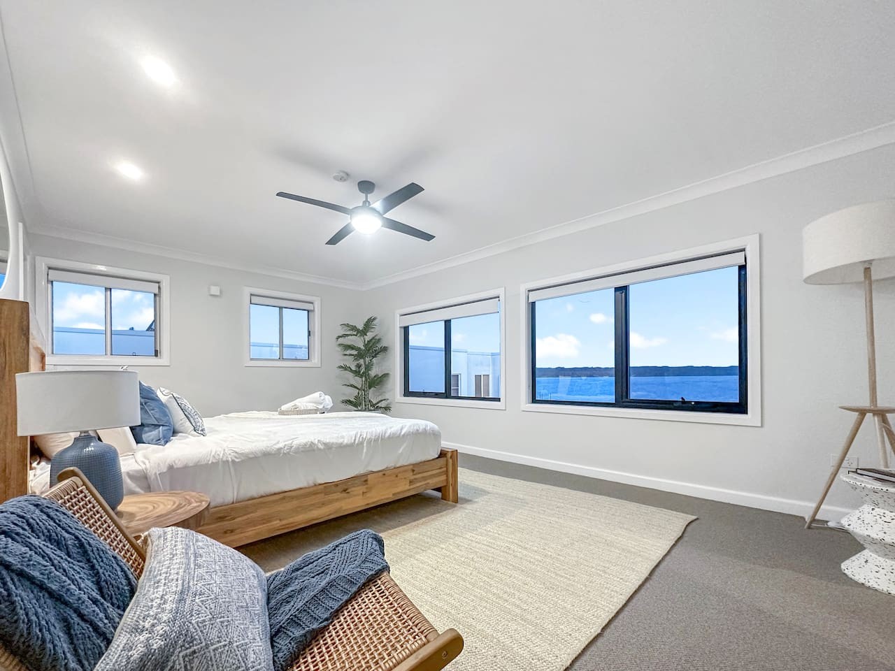 Retreat to serenity with a bedroom featuring a scenic lake view.