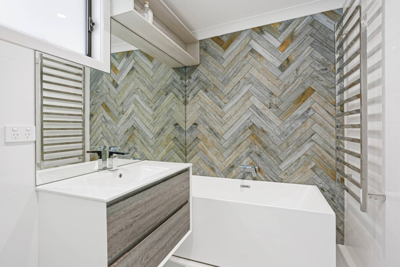 Relax and rejuvenate in our luxurious bathroom with a bathtub.