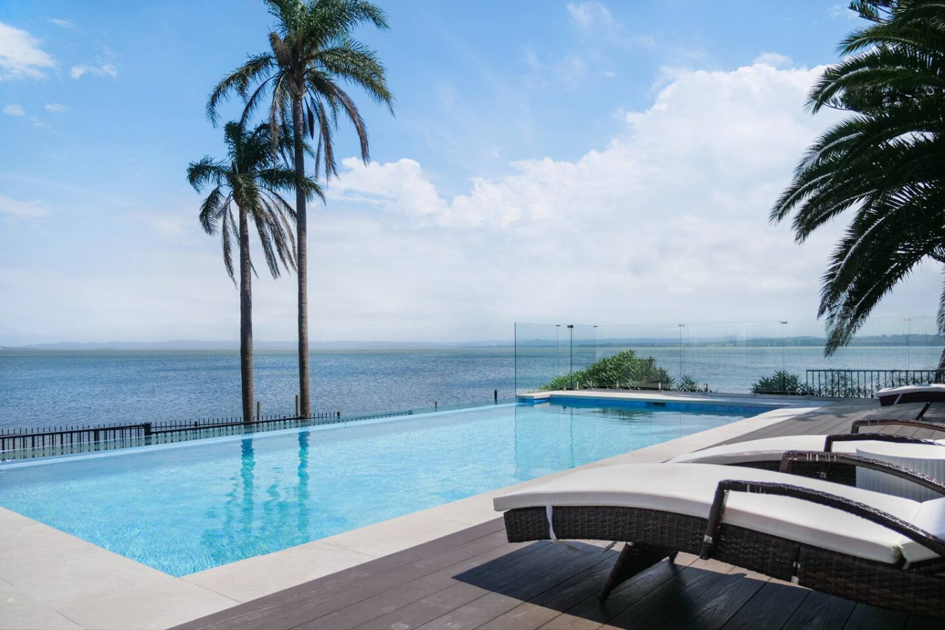 Relax and unwind by the pool with a breathtaking lakefront view.