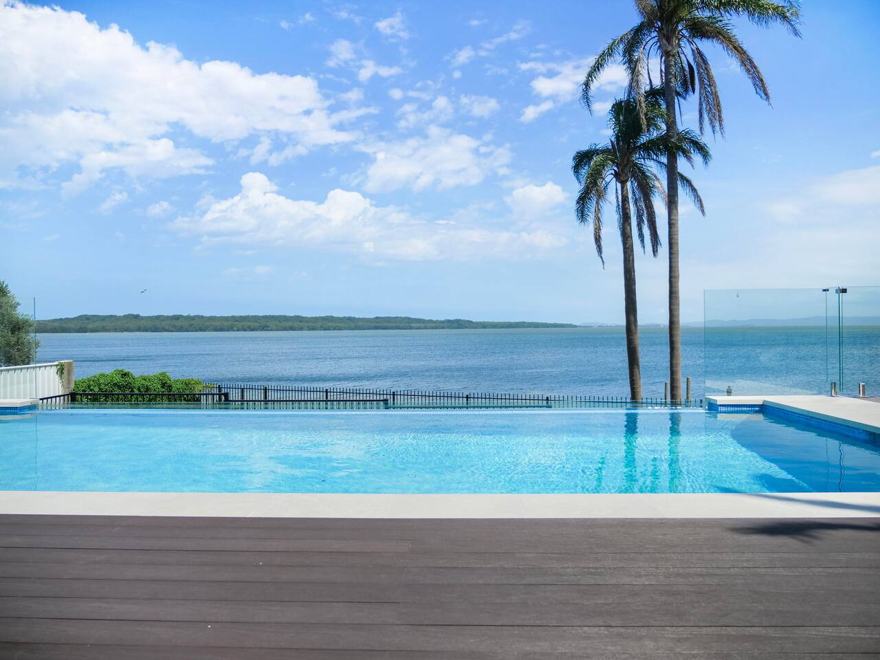 Enjoy the serenity of our pool with stunning lakefront vistas.
